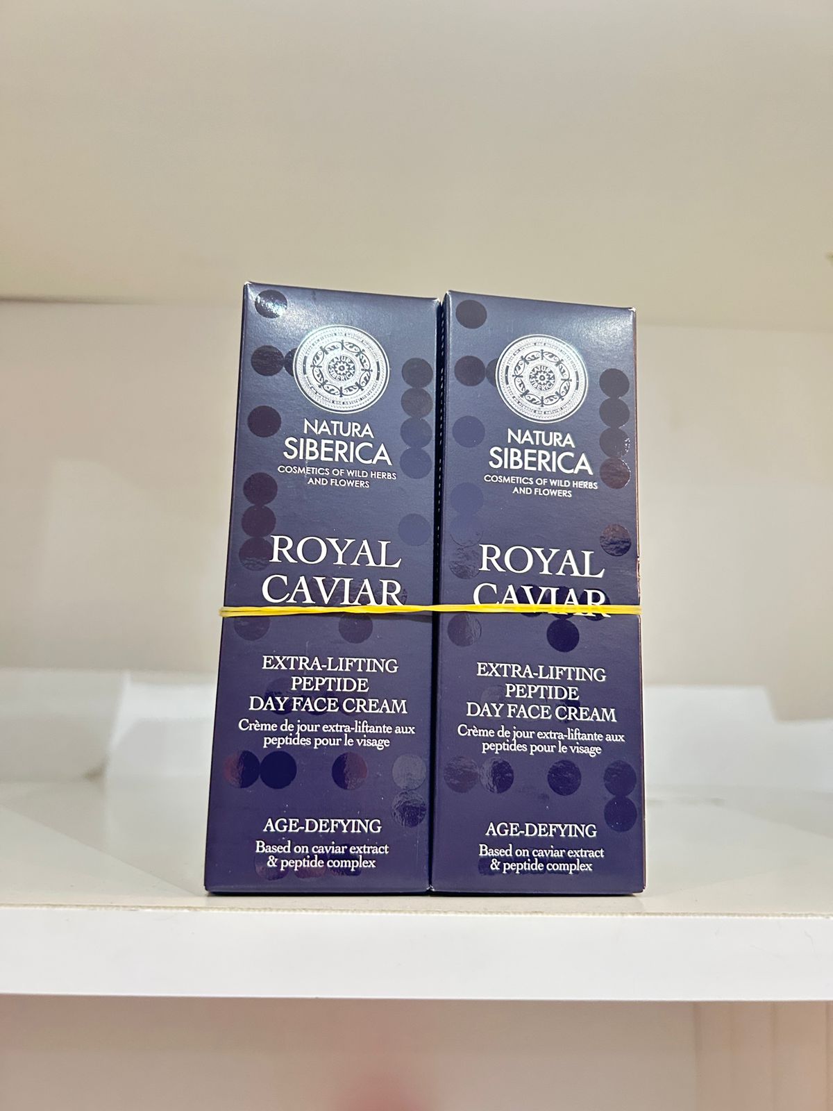 Natura Siberica Royal Caviar Age Defying Day Cream 50ml on display, offering skin care benefits with black caviar extract.